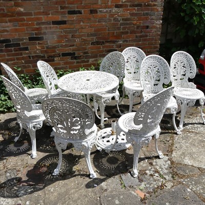 Lot 673 - A reproduction white painted cast metal patio...