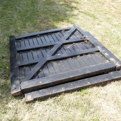 Lot 574 - A pair of black painted wooden gates, each 69...