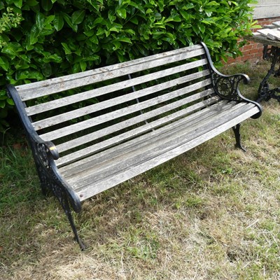 Lot 593 - A wooden slatted garden bench, with Victorian...
