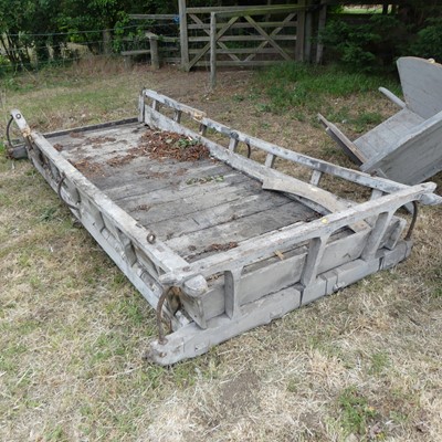 Lot 669 - An antique stained wood and iron bound cart...