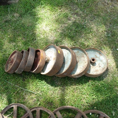 Lot 681 - Two sets of four cast iron wheels