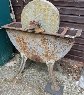 Lot 413 - A large cast iron grinding wheel, with central...