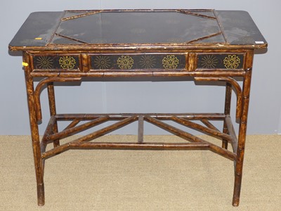 Lot 702 - A stained, lacquered and floral decorated...