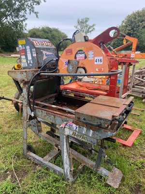 Lot 416 - A masonry bench saw, together with a metal...