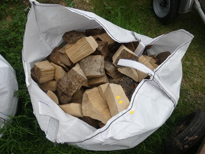 Lot 555 - A grab bag containing seasoned firewood
