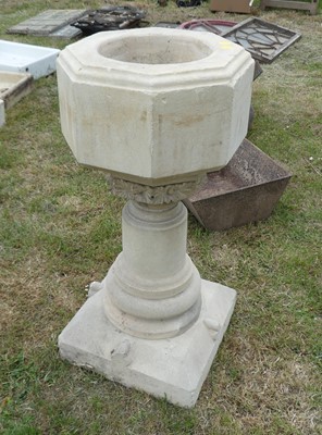 Lot 613 - A reconstituted stone pedestal font