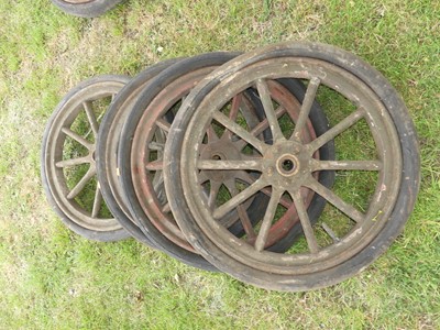 Lot 919 - A set of four 25.5" wooden spoked motoring...