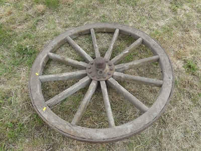 Lot 689 - A Victorian wooden and cast iron 48" cartwheel