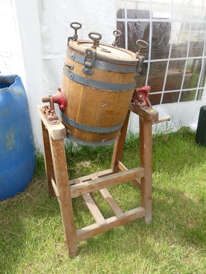 Lot 700 - A butter churn on stand