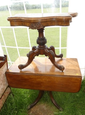 Lot 784 - A 19th century walnut fold-over games table;...