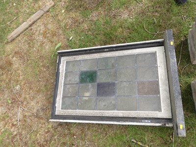 Lot 603 - A lead stained glass window and eight stone...