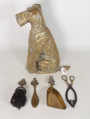 Lot 54 - A brass fireside companion stand in the form...