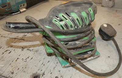 Lot 91 - A Makita 240volt belt sander; together with a...