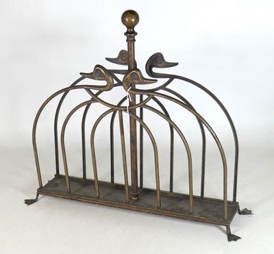Lot 69 - A brass magazine rack, the divisions with duck...