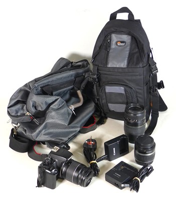 Lot 70 - A Canon 1000d SLR camera, with two lenses and...