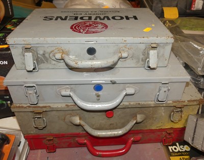 Lot 219 - Four metal storage cases containing a quantity...