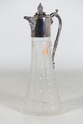 Lot 84 - A silver-plated and cut glass claret jug, the...
