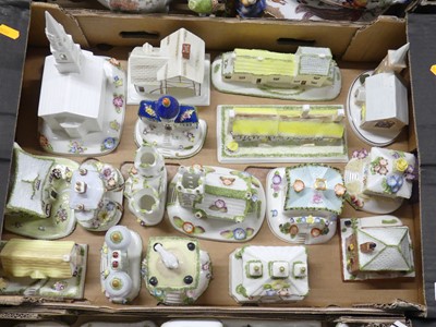Lot 106 - A collection of Coalport model cottages and...