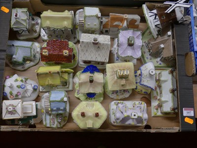 Lot 107 - A collection of Coalport model cottages and...