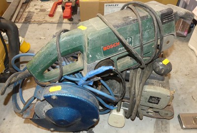 Lot 272 - A Bosch PBS75A belt sander; a circular saw;...