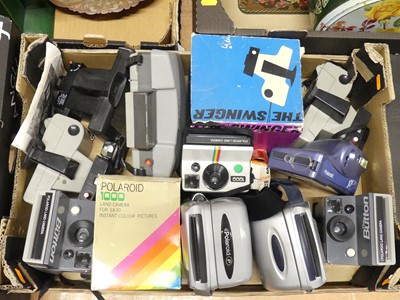 Lot 125 - A collection of Polaroid cameras, to include...