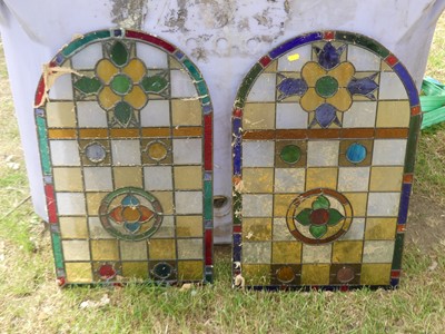 Lot 624 - A pair of coloured glass arch topped lead lights