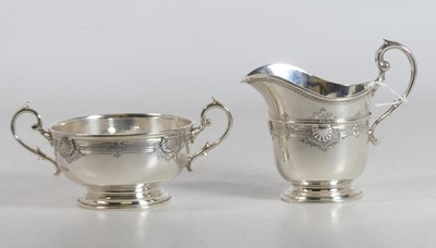 Lot 231 - A George V silver cream jug, of helmet shape,...
