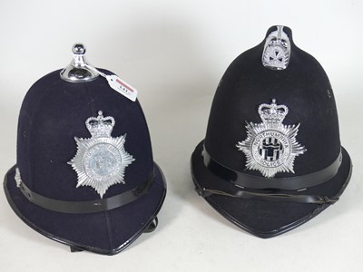 Lot 141 - A Northumbria police helmet, together with a...