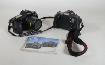 Lot 192 - A Canon EOS 650 camera body, with a zoom lens,...