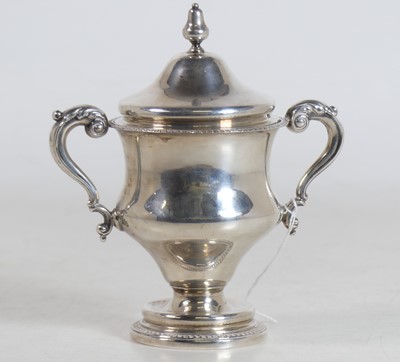 Lot 226 - A George V silver twin-handled trophy cup and...