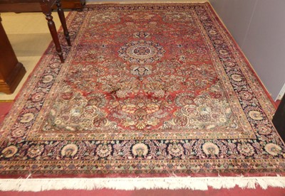 Lot 738 - A Persian red and blue woollen Mohajeran...