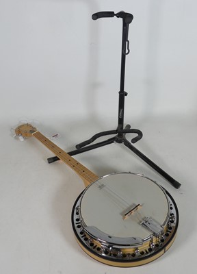 Lot 175 - A Barnes & Mullins four-string banjo, having a...