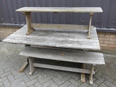 Lot 754 - A slatted teak patio table, length 152cm,...