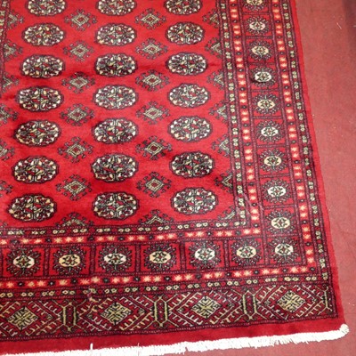 Lot 741 - Two similar Persian woollen red-ground Bokhara...