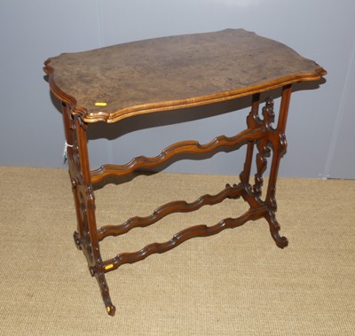 Lot 645 - A mid-Victorian figured walnut shaped top...