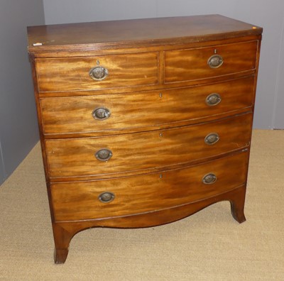 Lot 657 - A Regency mahogany bowfront chest of two short...