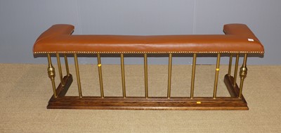 Lot 665 - An oak, gilt brass and tan leather upholstered...