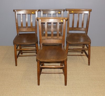 Lot 698 - A set of four early 20th century elm seat and...