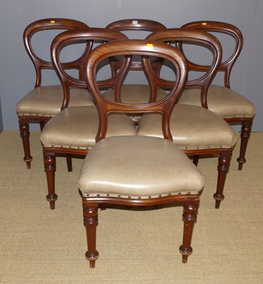 Lot 699 - A set of six mahogany balloon back dining...