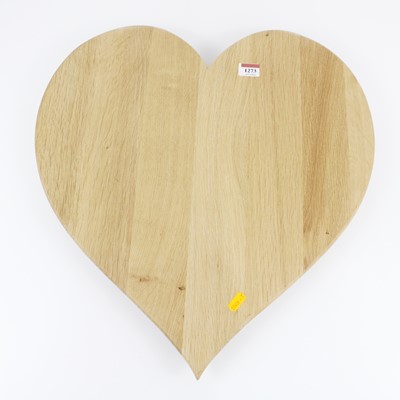 Lot 1273 - A contemporary oak heart shaped cheeseboard on...