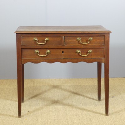 Lot 660 - A George III provincial oak and mahogany...