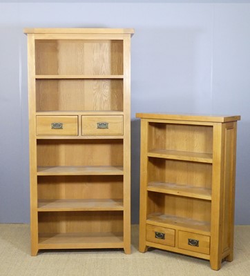 Lot 641 - A blond oak freestanding open bookshelf, with...