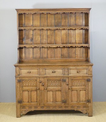 Lot 627 - A joined oak dresser, with a two-tier open...