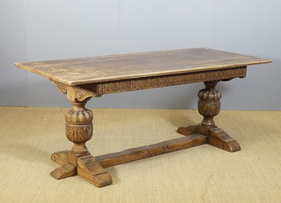Lot 674 - A joined oak refectory dining table, raised on...