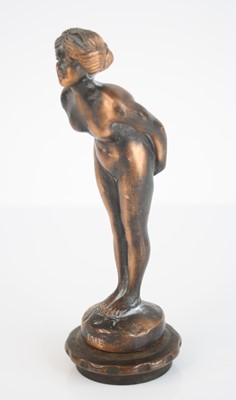 Lot 17 - A bronze alloy car mascot modelled as a nude...