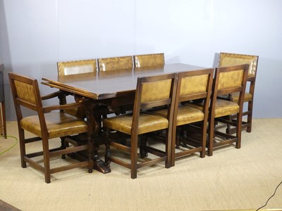 Lot 697 - A joined oak dining suite, comprising;...