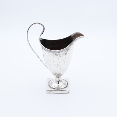 Lot 228 - A George III silver pedestal cream jug, of...