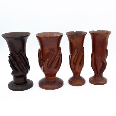 Lot 12 - A group of four Pitcairn Island carved miro...