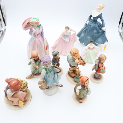 Lot 67 - A group of four Royal Doulton figures of...