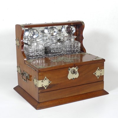 Lot 29 - An Edwardian mahogany three division tantalus,...